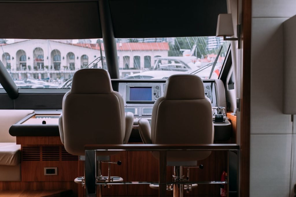 Crafting Captivating Headlines: Your awesome post title goes here Sophisticated yacht interior showcasing a modern cockpit with leather seats and large windows overlooking a marina.